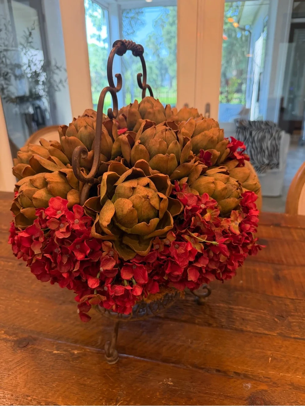 Rustic Iron Basket Centerpiece with Green Artichoke and Red Hydrangea Accents
